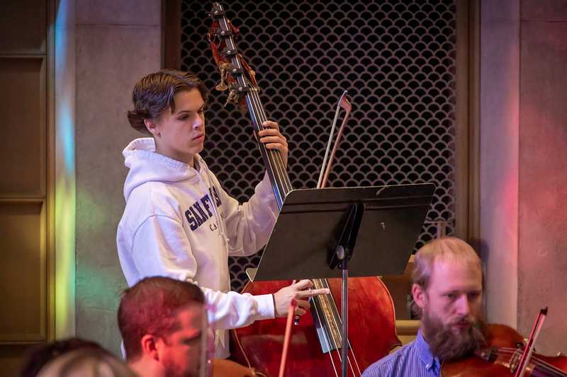 Standing: Quinn Judge, bass